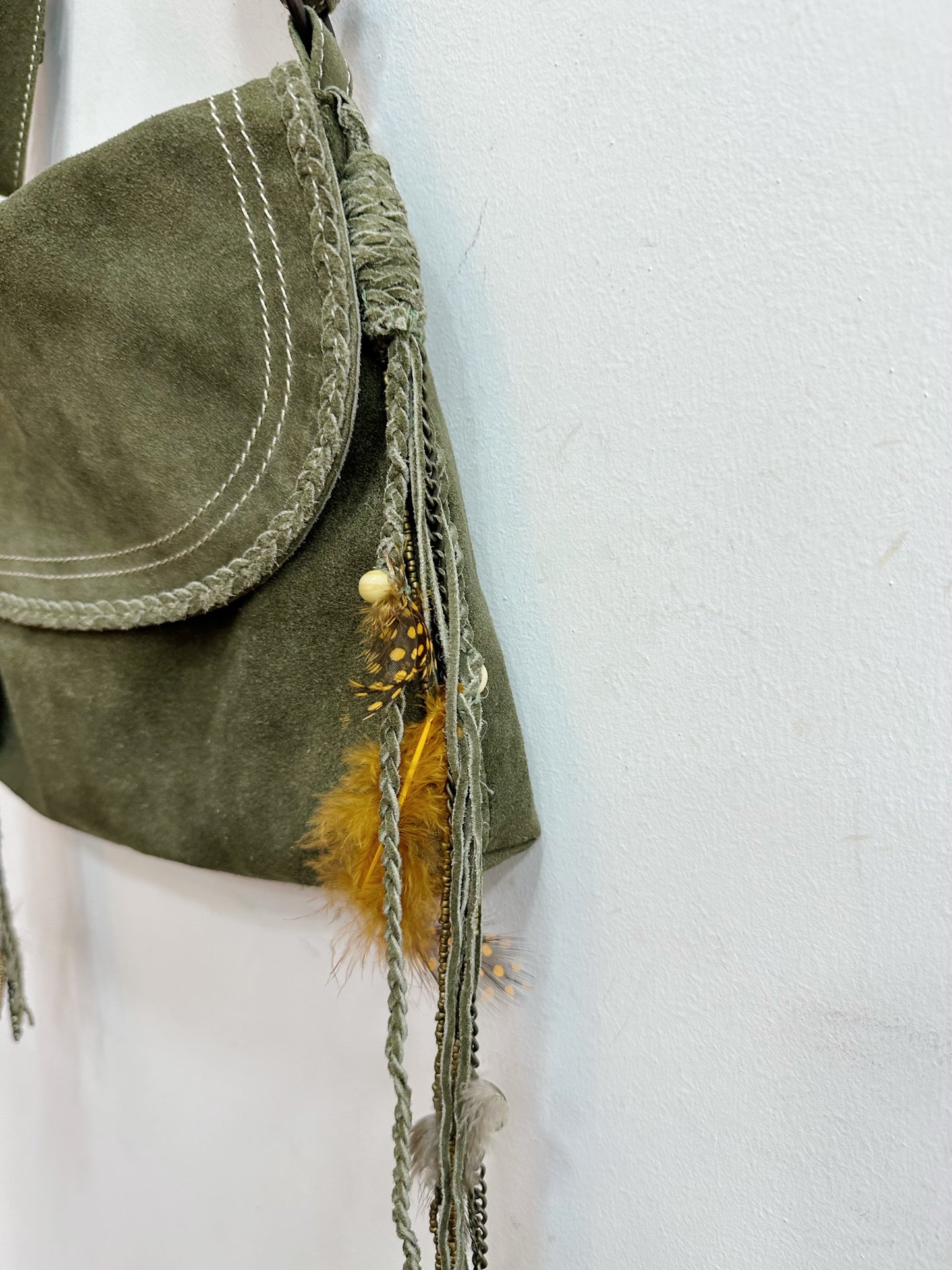 Leather shoulder bag with feather details