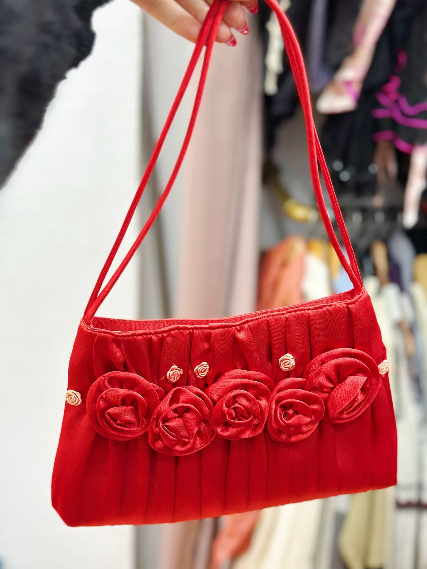 Red satin bag with flowers