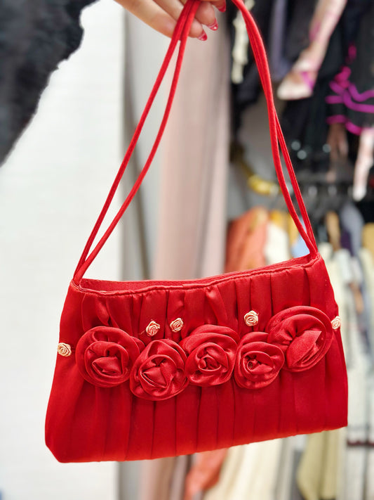 Red satin bag with flowers